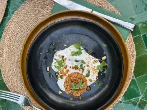 Healthy Mediterranean dinner dish served at Palm Ibiza, featuring fresh seasonal ingredients in a stylish Ibiza setting