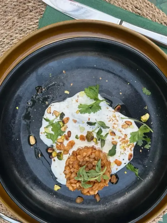 Healthy Mediterranean dinner dish served at Palm Ibiza, featuring fresh seasonal ingredients in a stylish Ibiza setting