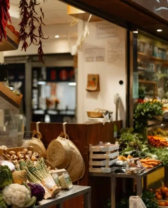 Local food market in Mallorca with seasonal produce, artisanal stalls and locals shopping