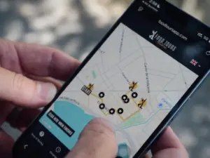 Person following a self-guided food tour route on the Food Tours Balearics web app map in Palma de Mallorca