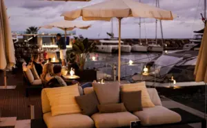 Sunset dining in Ibiza with sea views, Mediterranean dishes and a coastal restaurant terrace at golden hour.