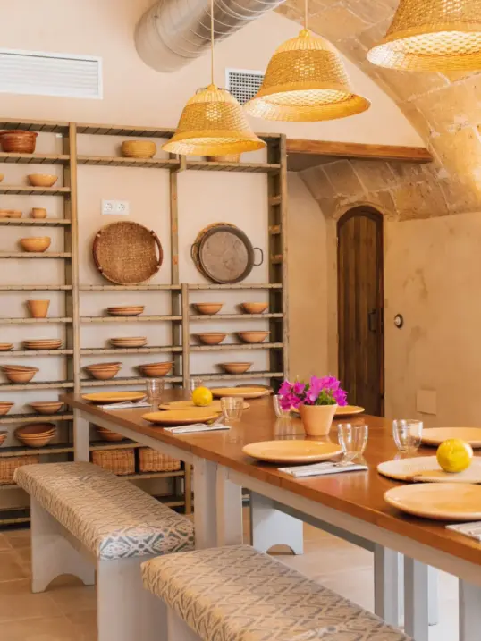 Cooking class in Palma de Mallorca at Moltak windmill kitchen with communal table set for a hands-on Balearic food experience