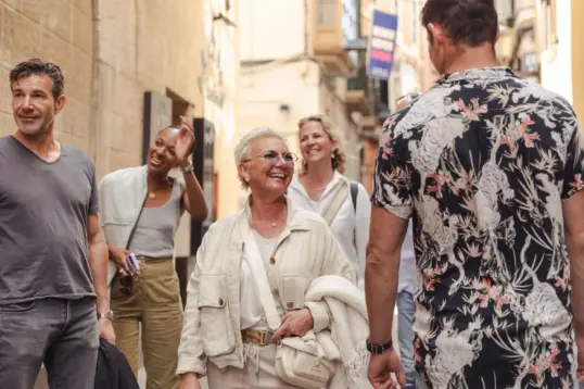 Tourists visiting the Balearics in October on a food tour in Palma Old Town