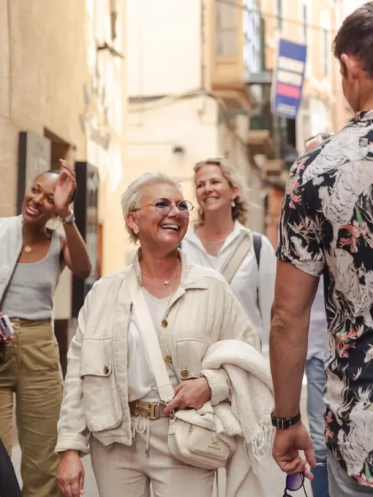 Tourists visiting the Balearics in October on a food tour in Palma Old Town